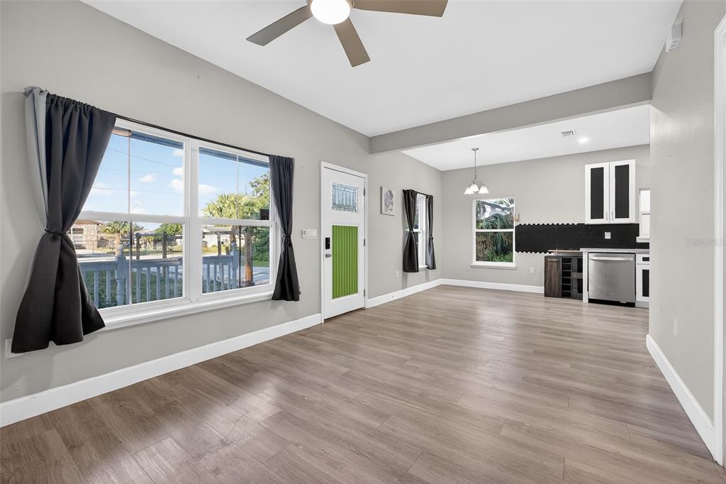 3633 Main Street Sanford, FL 32771 - Photo 5 of 31 a view of an empty room with a window and kitchen view