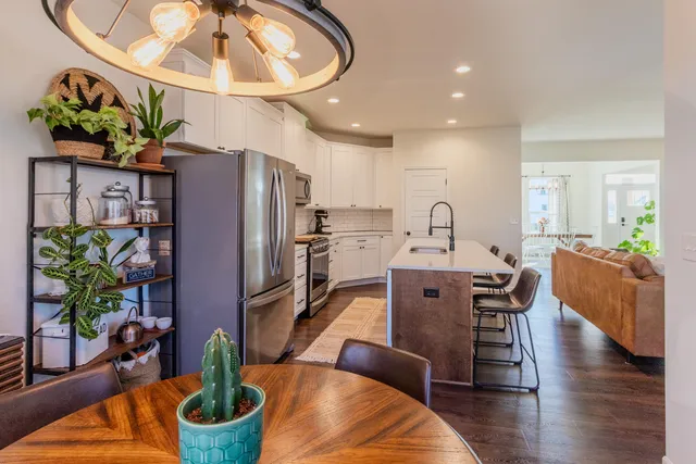 a view of a dining room with furniture window and wooden floor