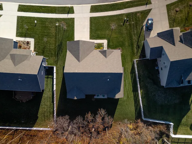 a view of a couches and a table in the balcony