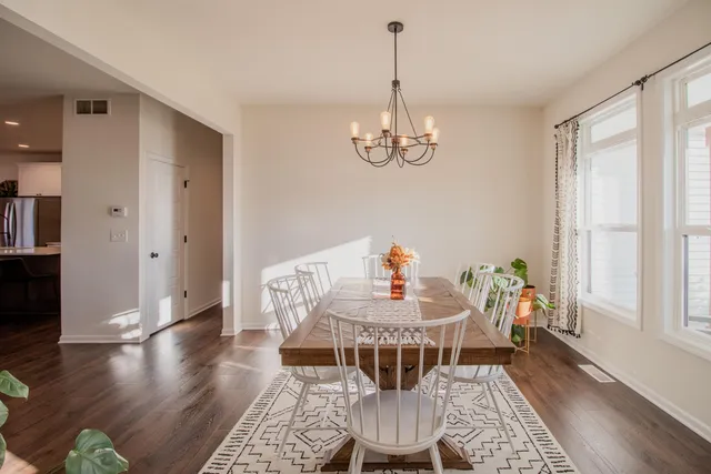 a view of a dining room with furniture window and wooden floor