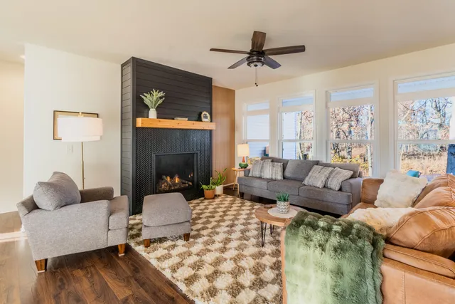 a living room with furniture and a fireplace