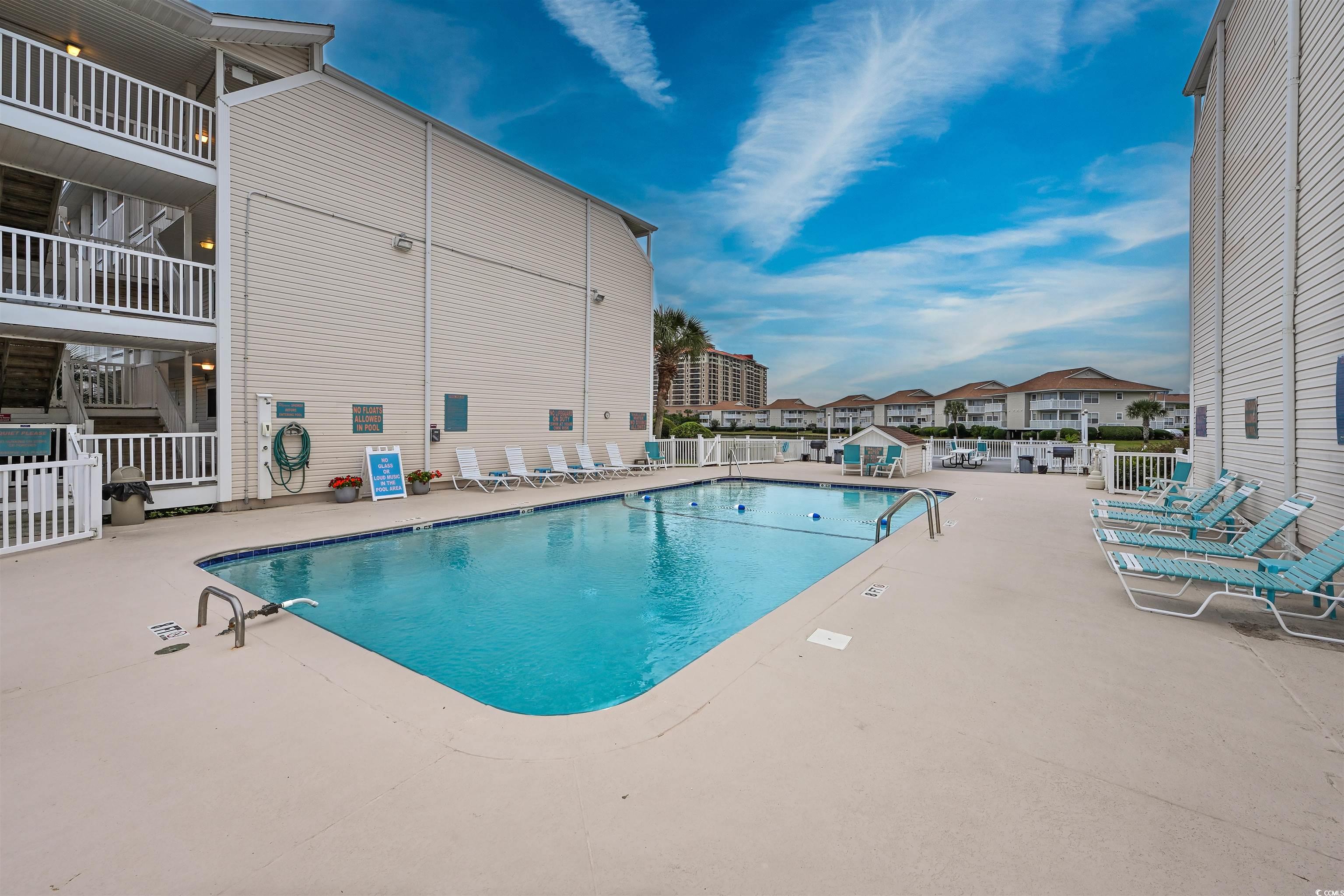 1919 Spring Street, Unit B14 North Myrtle Beach, SC 29582 - Photo 21 of 25 View of swimming pool featuring a patio area