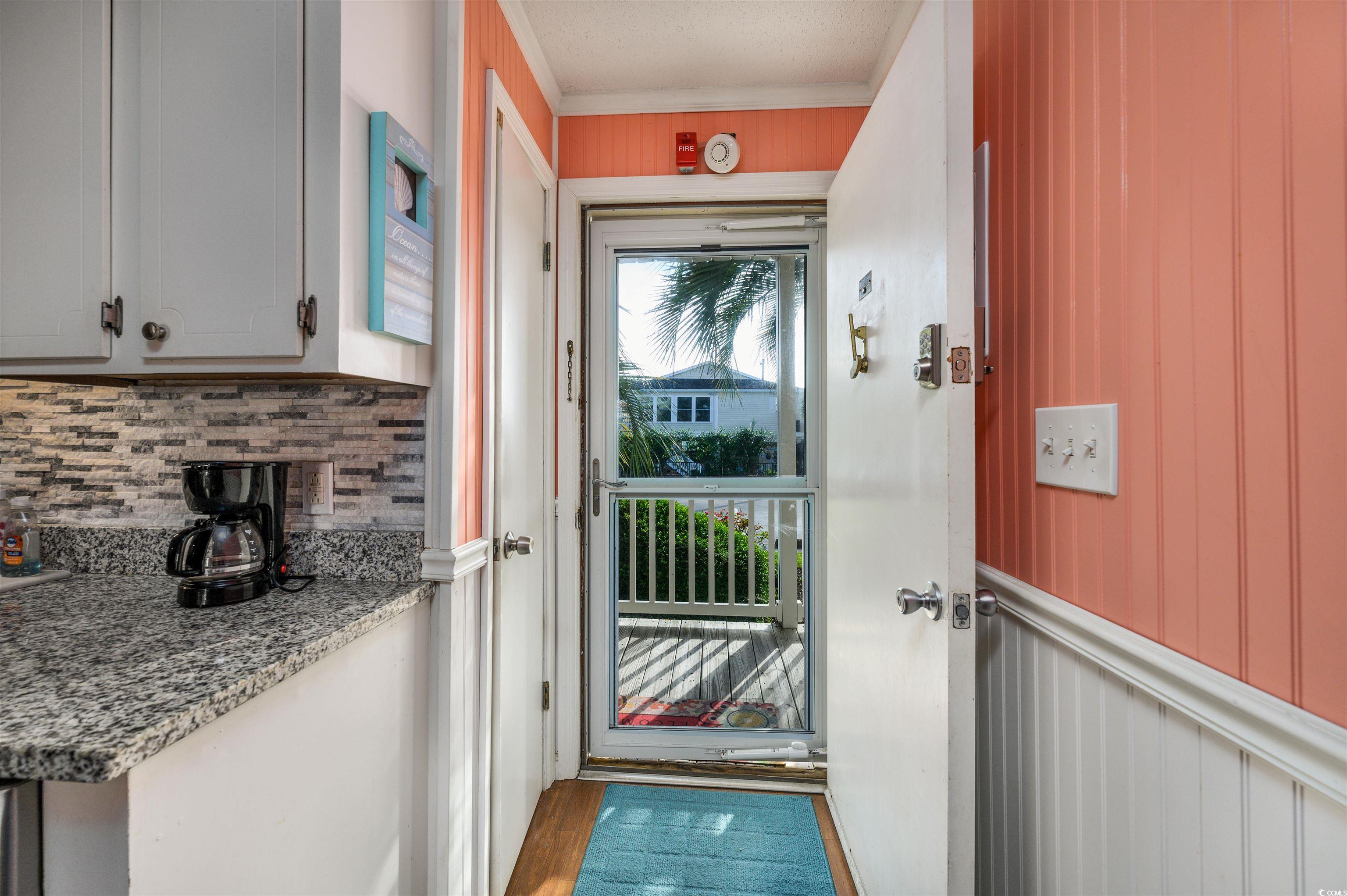 1919 Spring Street, Unit B14 North Myrtle Beach, SC 29582 - Photo 3 of 25 Doorway with light hardwood / wood-style floors an