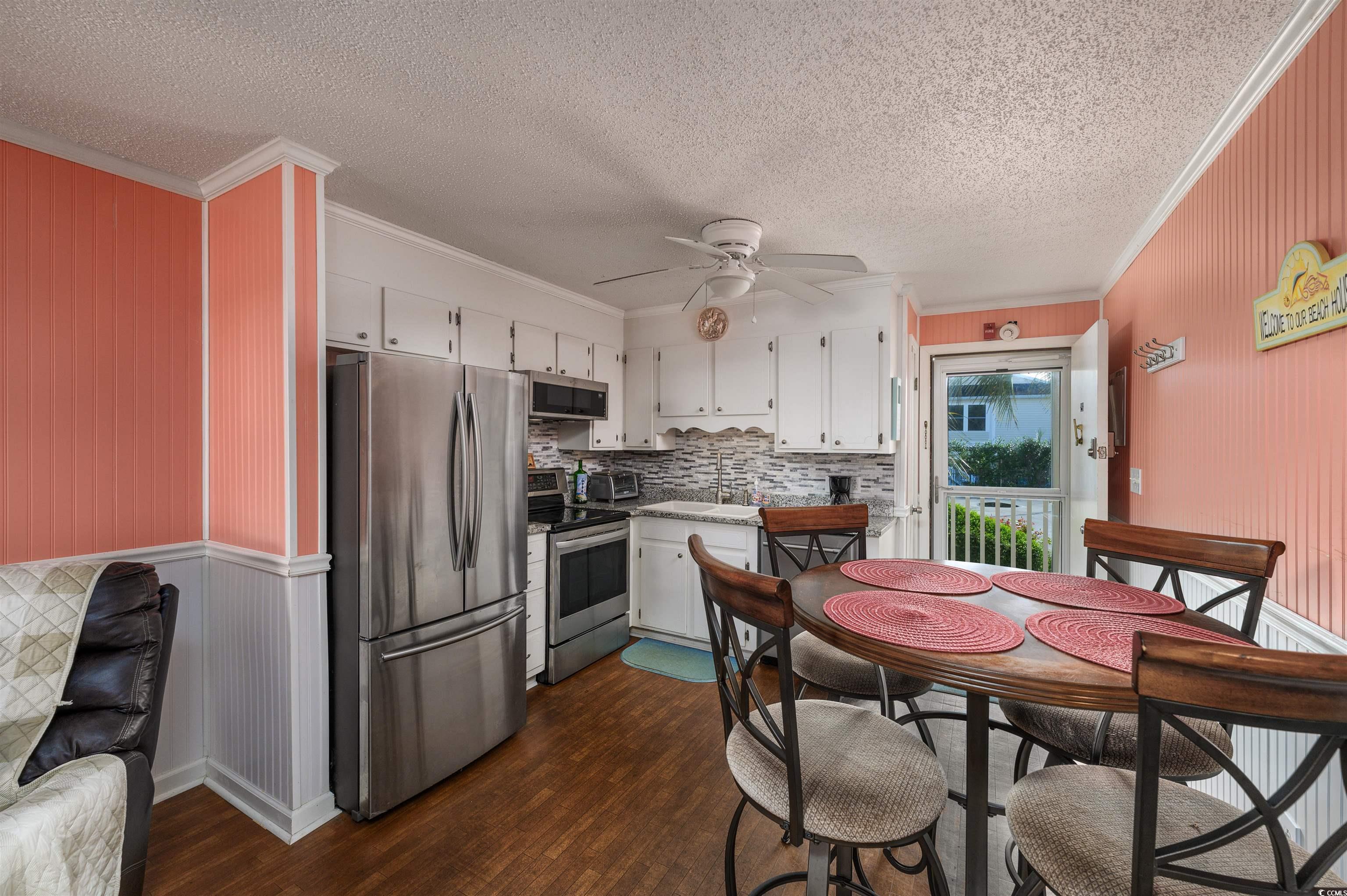 1919 Spring Street, Unit B14 North Myrtle Beach, SC 29582 - Photo 6 of 25 Kitchen with ceiling fan, stainless steel applianc