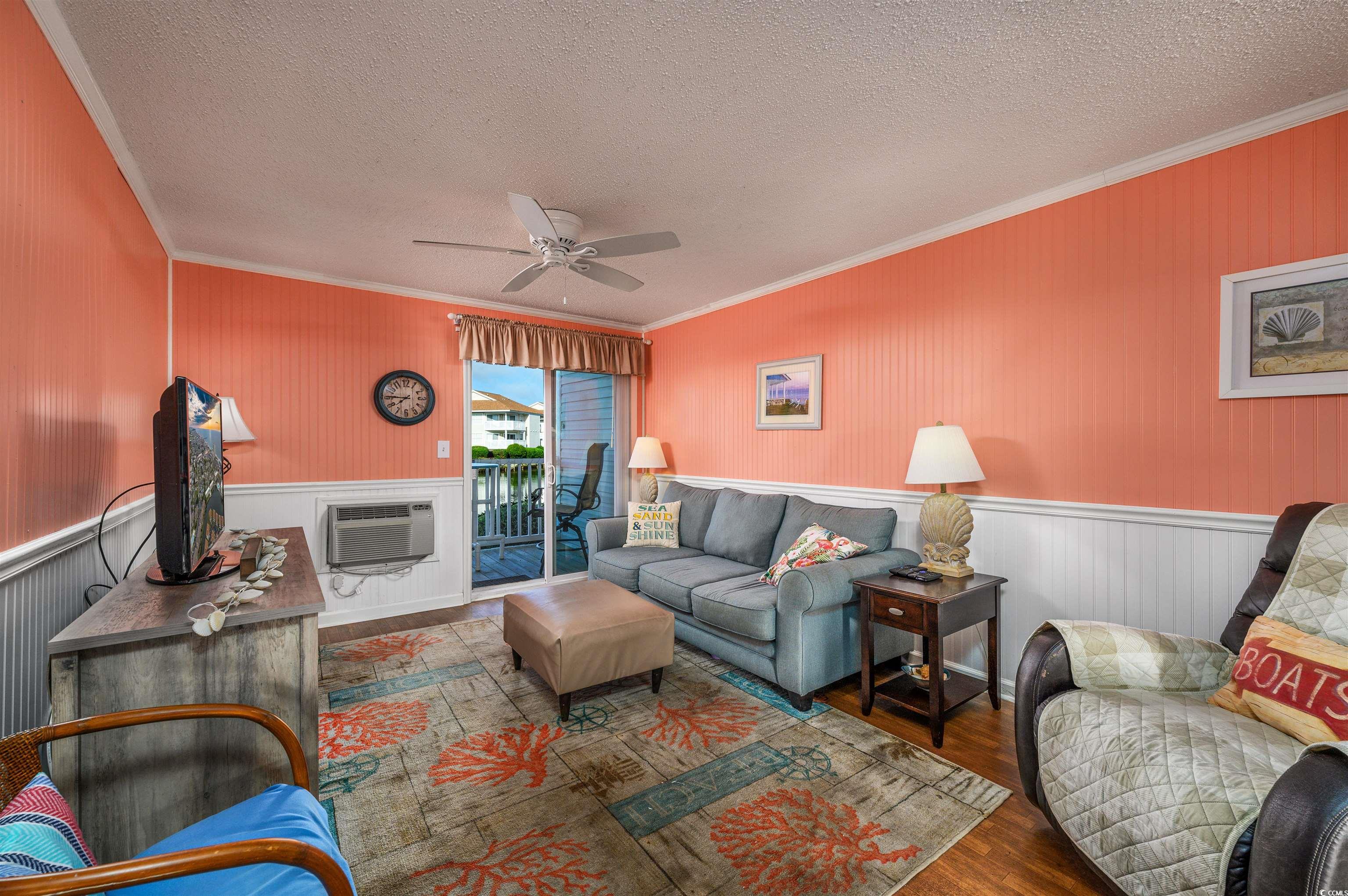 1919 Spring Street, Unit B14 North Myrtle Beach, SC 29582 - Photo 8 of 25 Living room featuring dark hardwood / wood-style f