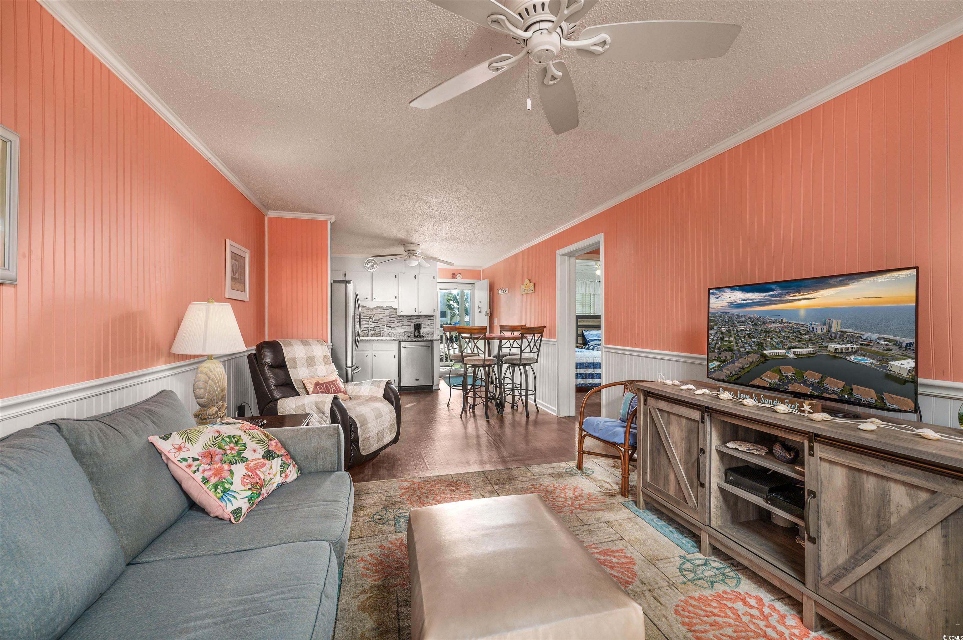 1919 Spring Street, Unit B14 North Myrtle Beach, SC 29582 - Photo 9 of 25 Living room with a textured ceiling, ornamental mo