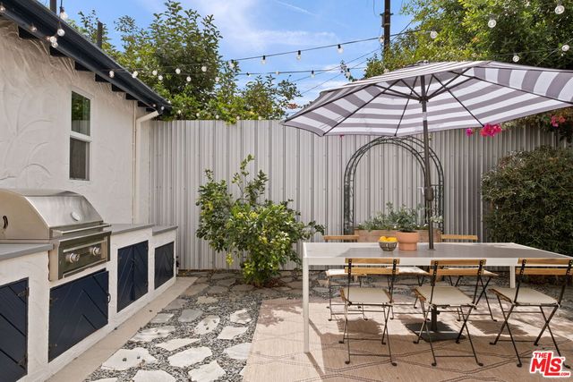 a patio with table and chairs