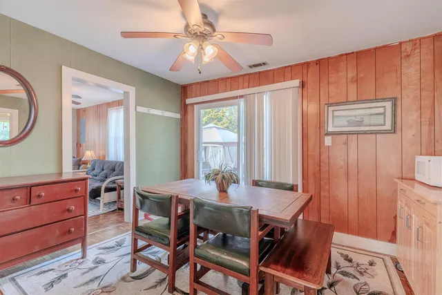 a dining room with furniture and window