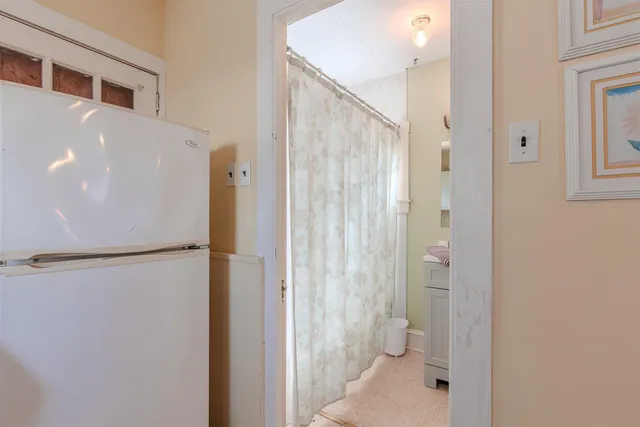 a bathroom with a shower and a toilet
