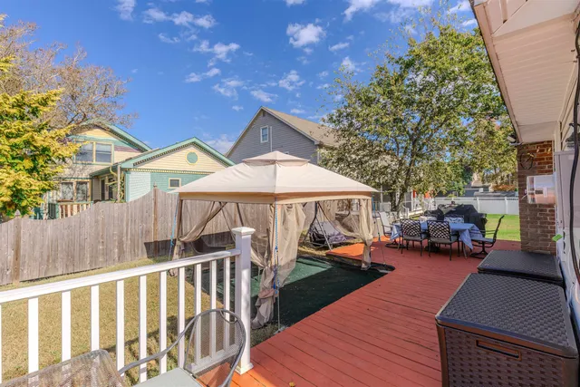 a view of a patio with couches chairs and a potted plant