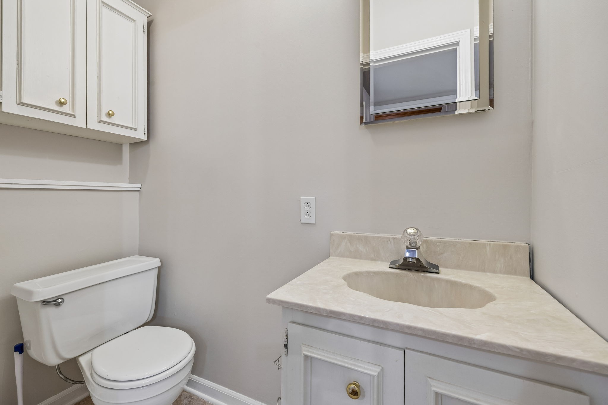 385 Perdue Road Franklin, KY 42134 - Photo 37 of 72 a white toilet sitting next to a bathroom sink