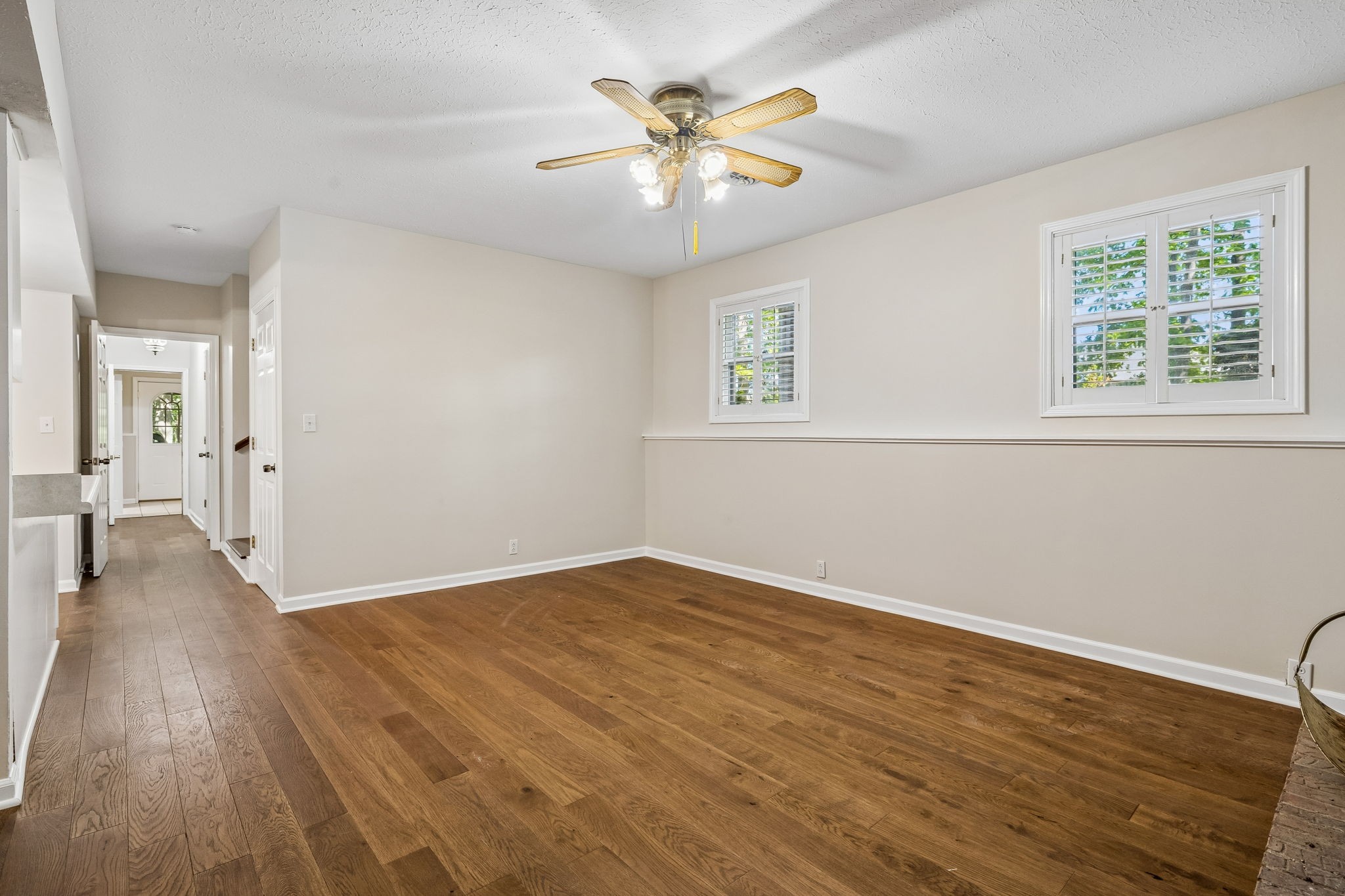 385 Perdue Road Franklin, KY 42134 - Photo 44 of 72 a view of an empty room with wooden floor and a window