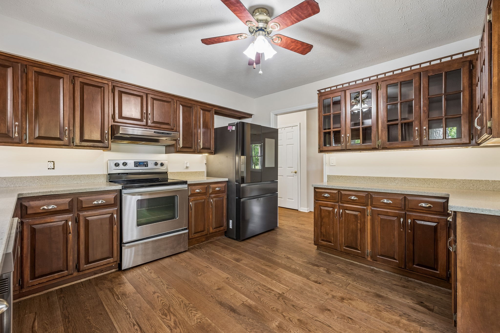 385 Perdue Road Franklin, KY 42134 - Photo 65 of 72 a kitchen with stainless steel appliances granite countertop a stove and a sink