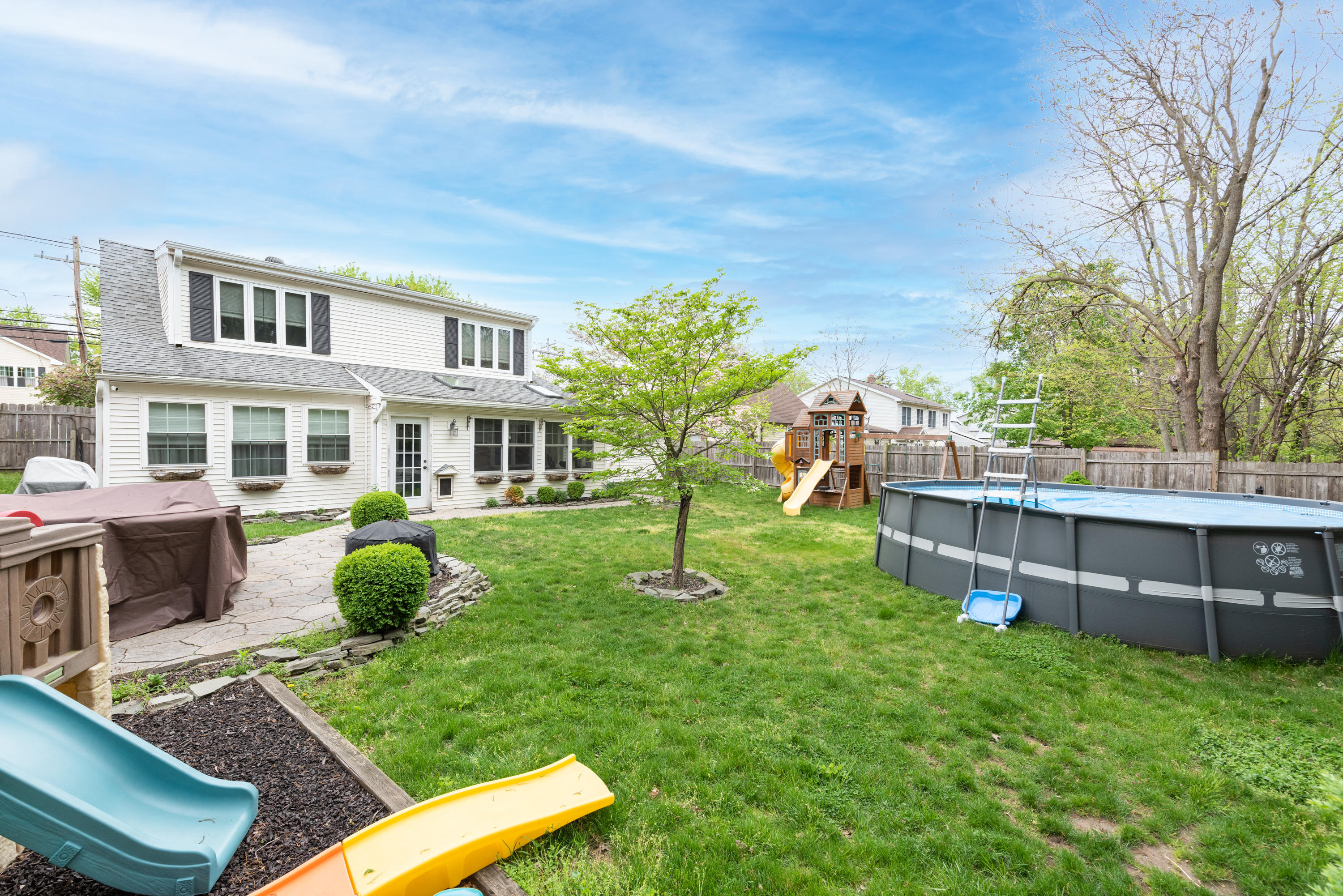 325 E Road Belford, NJ 07718 - Photo 22 of 23 a view of an house with backyard space and sitting area