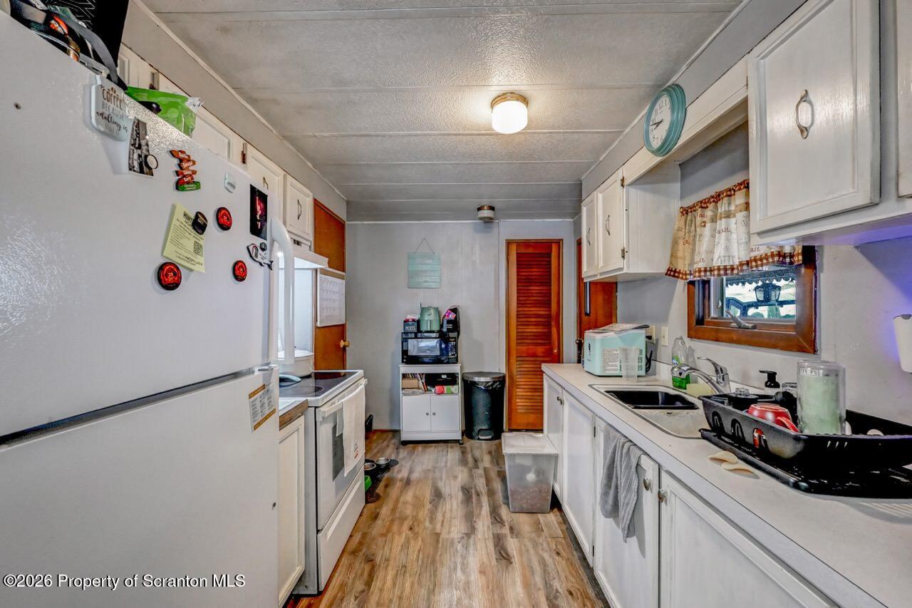 191 Poplar Street Archbald, PA 18403 - Photo 16 of 35 a kitchen with refrigerator and cabinets