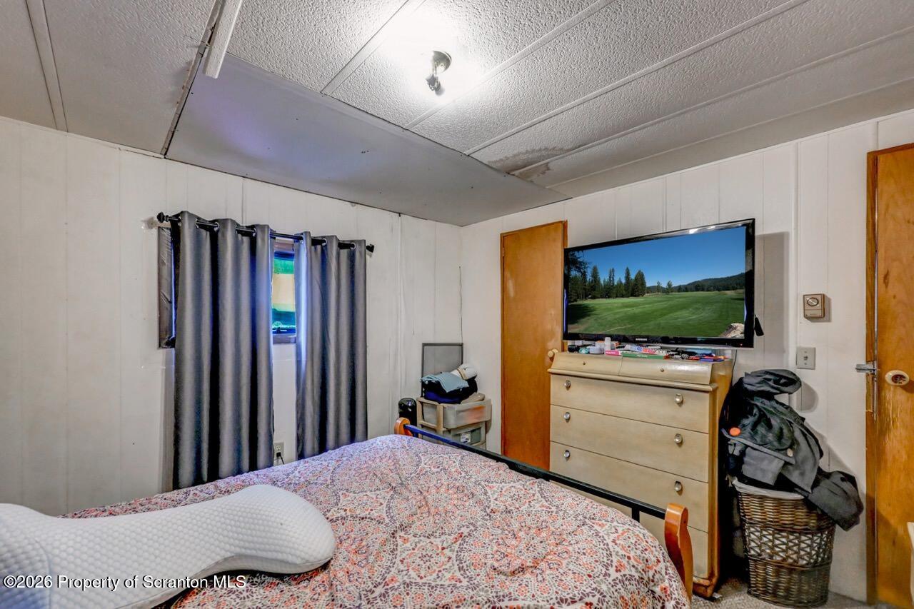 191 Poplar Street Archbald, PA 18403 - Photo 22 of 35 a bedroom with a bed and a flat screen tv