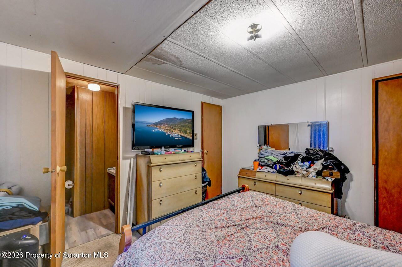 191 Poplar Street Archbald, PA 18403 - Photo 23 of 35 a bedroom with a bed and a tv