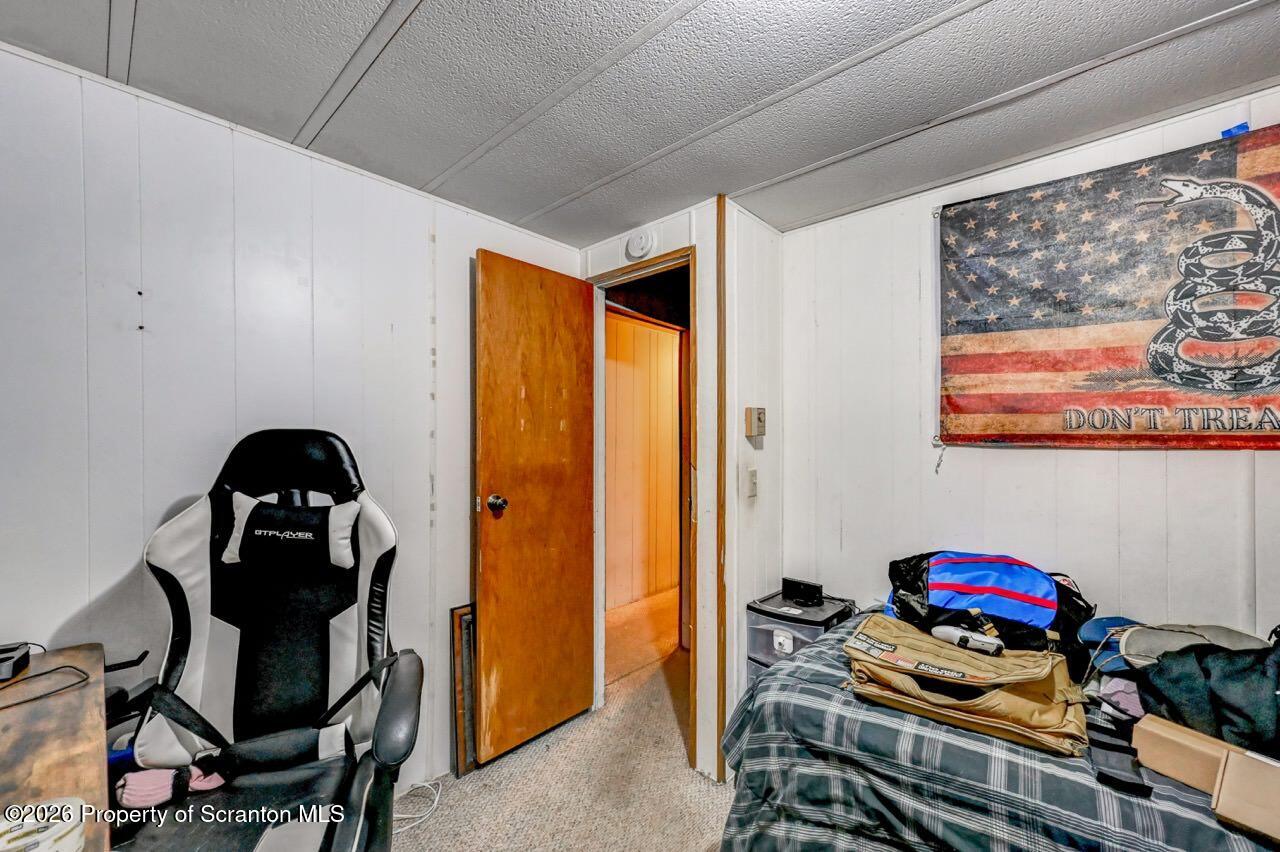 191 Poplar Street Archbald, PA 18403 - Photo 27 of 35 a bedroom with a bed and wooden floor