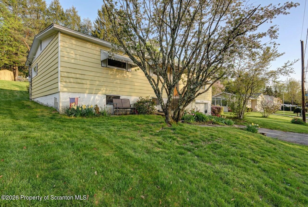 191 Poplar Street Archbald, PA 18403 - Photo 3 of 35 a front view of a house with a garden