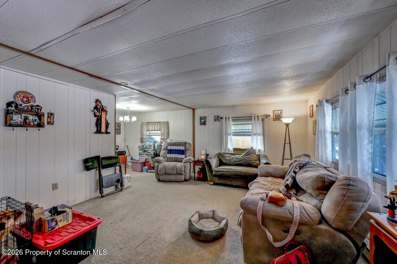 191 Poplar Street Archbald, PA 18403 - Photo 9 of 35 a living room with furniture and a gym