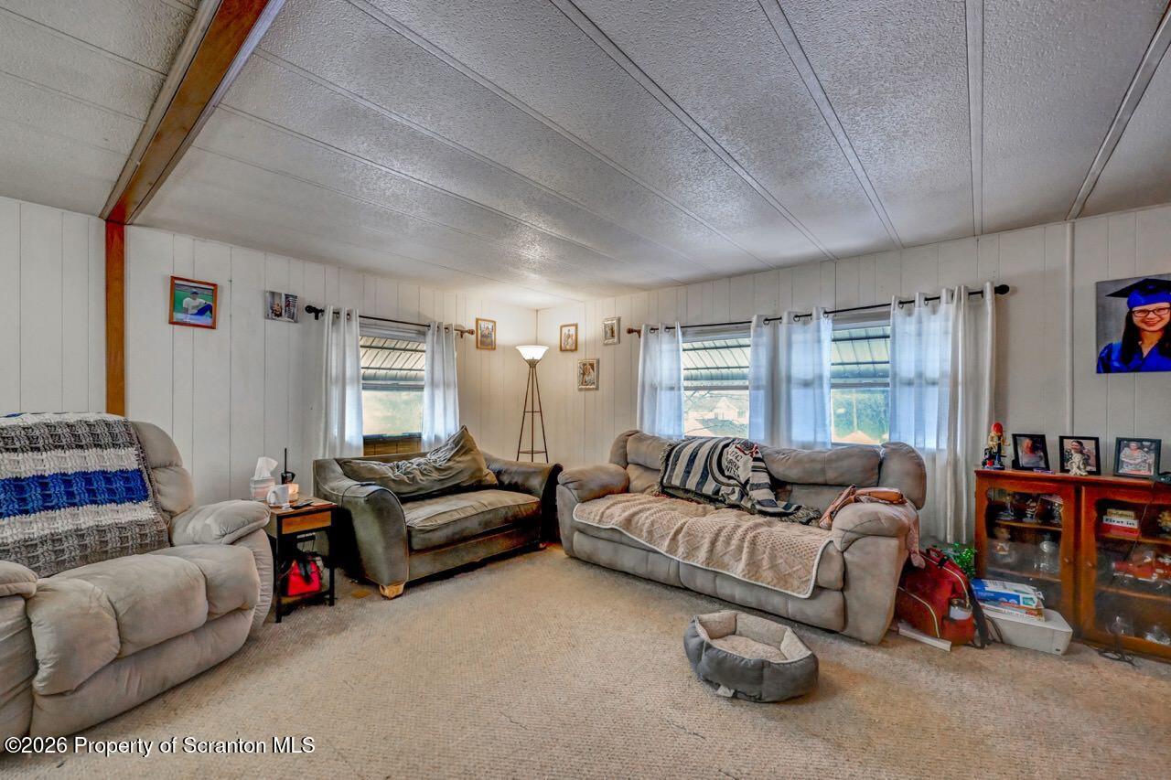 191 Poplar Street Archbald, PA 18403 - Photo 10 of 35 a living room with furniture a couch and a window