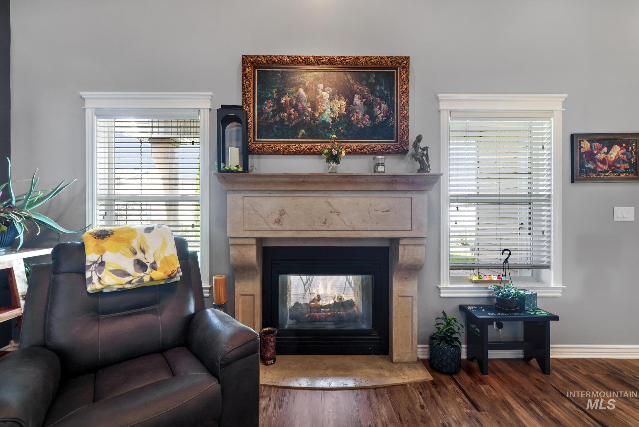 467 Wildrose Loop Twin Falls, ID 83301 - Photo 10 of 46 Elegant fireplace featuring a stone surround and hearth