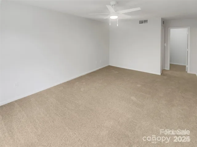 a white toilet sitting next to a white sink
