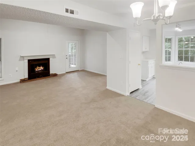 a kitchen with wooden floors and white appliances