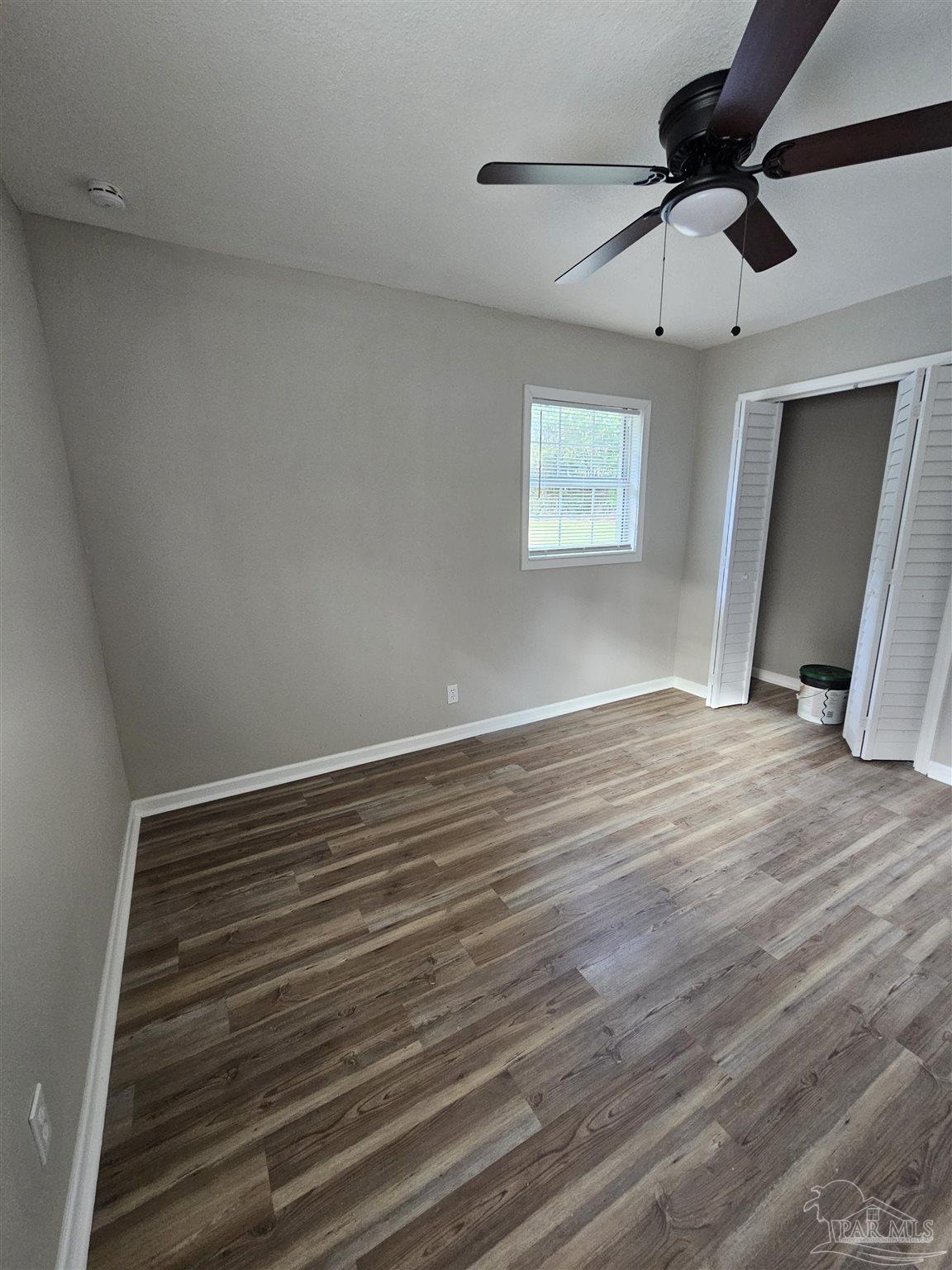 5357 Locklin Avenue Milton, FL 32570 - Photo 7 of 9 wooden floor in an empty room