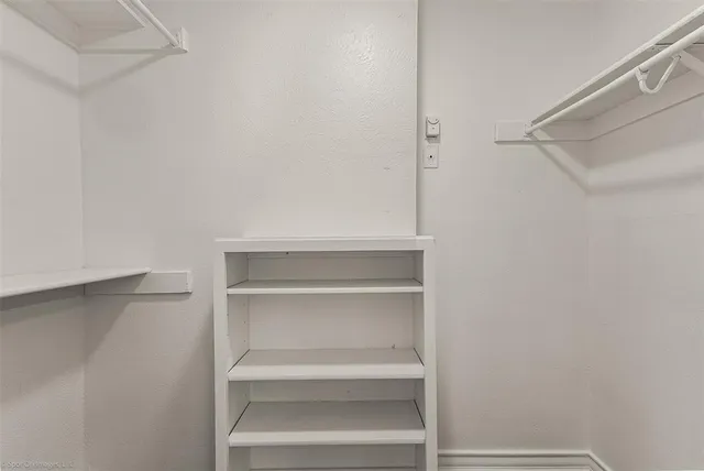 a view of an empty walk in closet