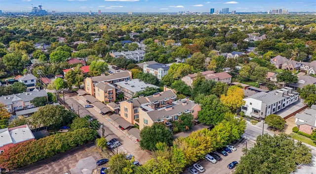 an aerial view of residential houses with outdoor space