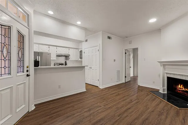 a view of a kitchen with wooden floor and a kitchen
