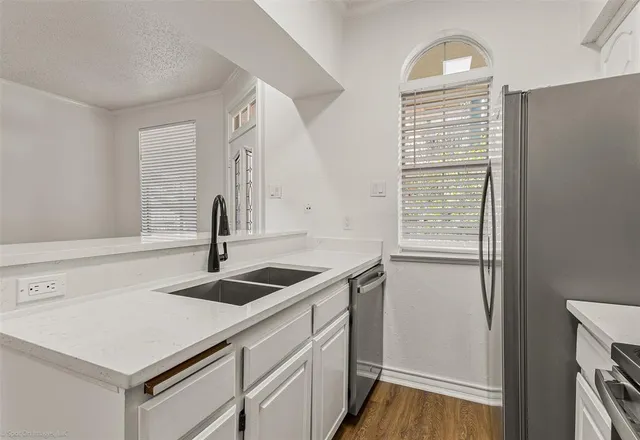 a kitchen with a sink and a window