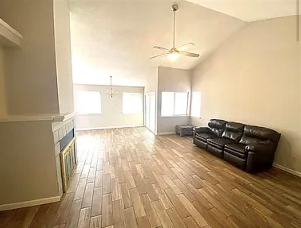 2614 Timberview Circle Corinth, TX 76210 - Photo 13 of 18 a living room with furniture and a chandelier
