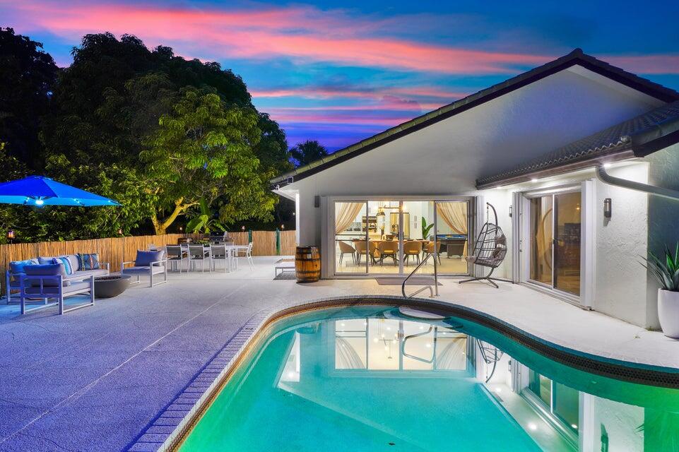 4526 St Andrews Drive Boynton Beach, FL 33436 - Photo 1 of 17 a view of a swimming pool with a patio
