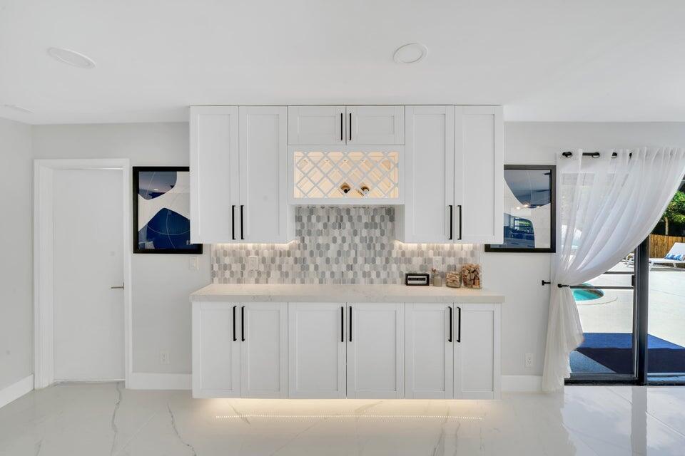 4526 St Andrews Drive Boynton Beach, FL 33436 - Photo 14 of 17 a bathroom with a bathtub and a walk in closet