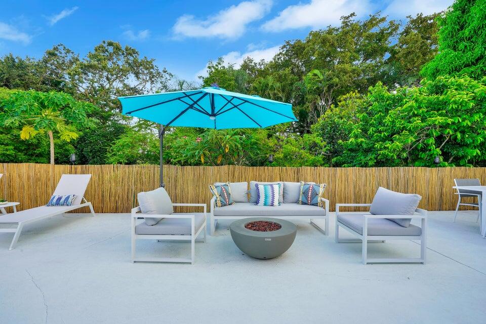 4526 St Andrews Drive Boynton Beach, FL 33436 - Photo 15 of 17 an outdoor sitting area with furniture and wooden deck