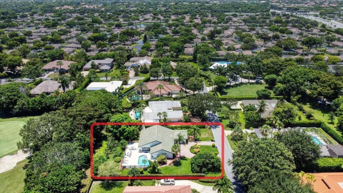 4526 St Andrews Drive Boynton Beach, FL 33436 - Photo 17 of 17 an aerial view of residential houses with outdoor space and trees all around