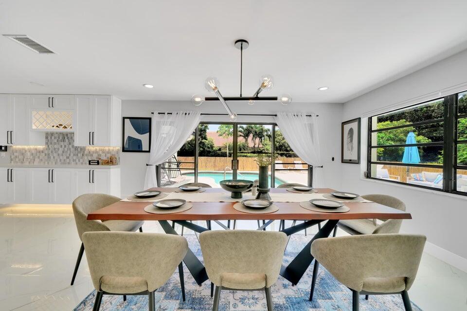 4526 St Andrews Drive Boynton Beach, FL 33436 - Photo 3 of 17 a view of a dining room with furniture and window