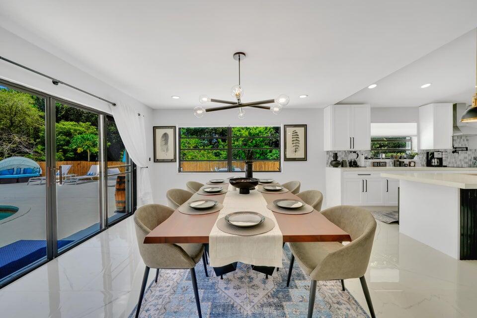 4526 St Andrews Drive Boynton Beach, FL 33436 - Photo 4 of 17 a view of a dining room with furniture window and outside view