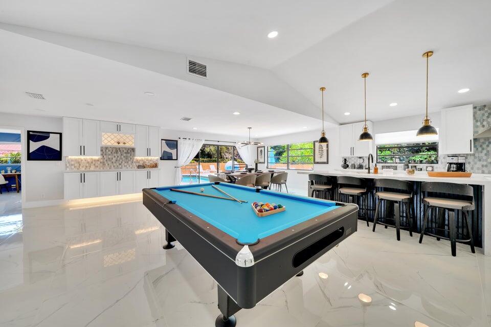 4526 St Andrews Drive Boynton Beach, FL 33436 - Photo 6 of 17 a living room with lots of furniture and kitchen view