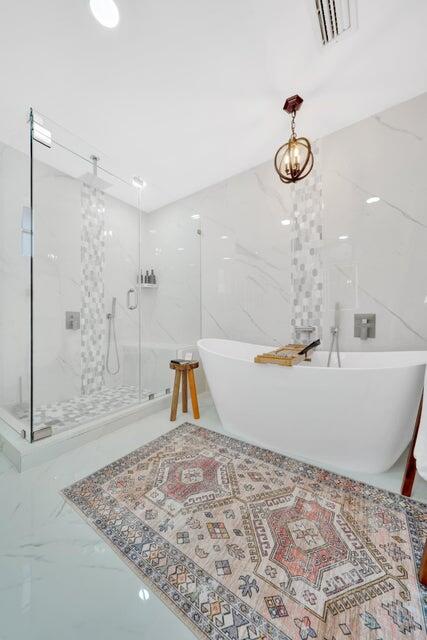 4526 St Andrews Drive Boynton Beach, FL 33436 - Photo 9 of 17 a view of a bathtub in a room