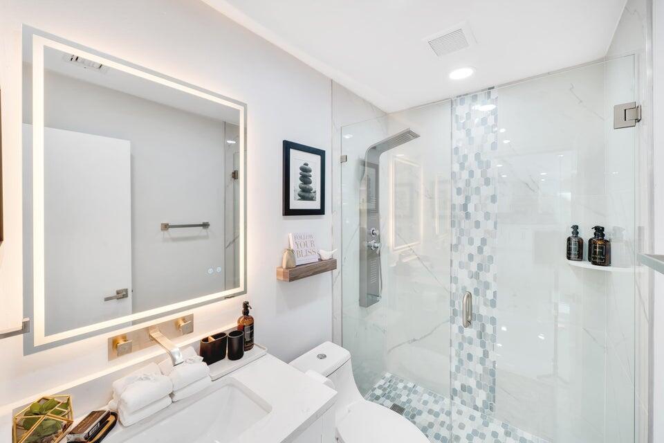 4526 St Andrews Drive Boynton Beach, FL 33436 - Photo 10 of 17 a bathroom with a sink and shower