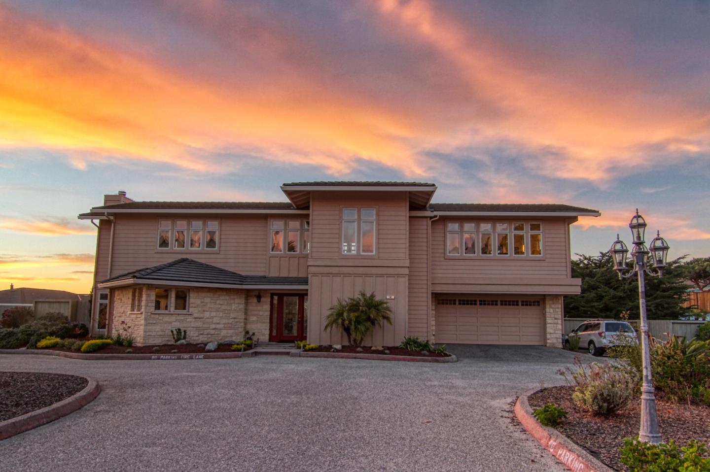 a front view of a house with garden