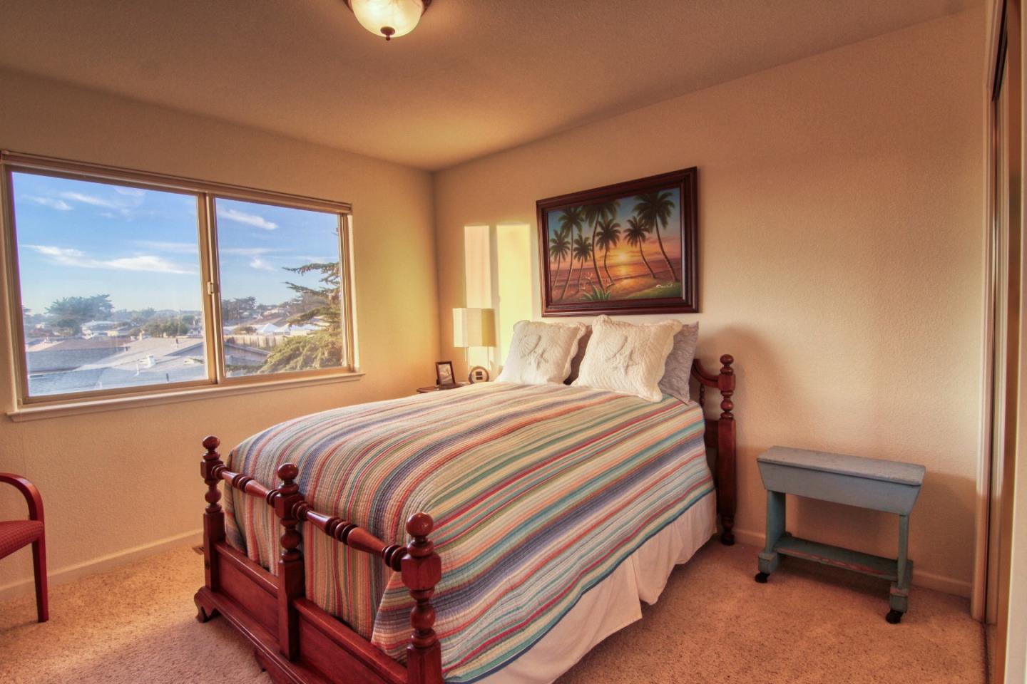 146 Katerina Lane Marina, CA 93933 - Photo 17 of 23 a bedroom with a bed and a window