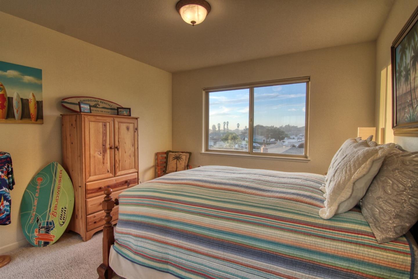 146 Katerina Lane Marina, CA 93933 - Photo 18 of 23 a bedroom with a bed and a window