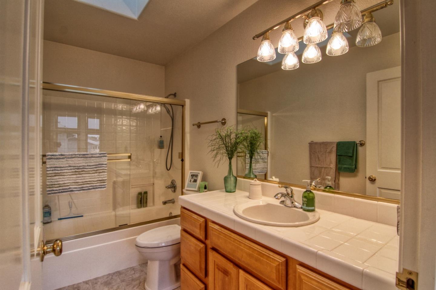 146 Katerina Lane Marina, CA 93933 - Photo 19 of 23 a bathroom with a sink toilet double vanity and shower