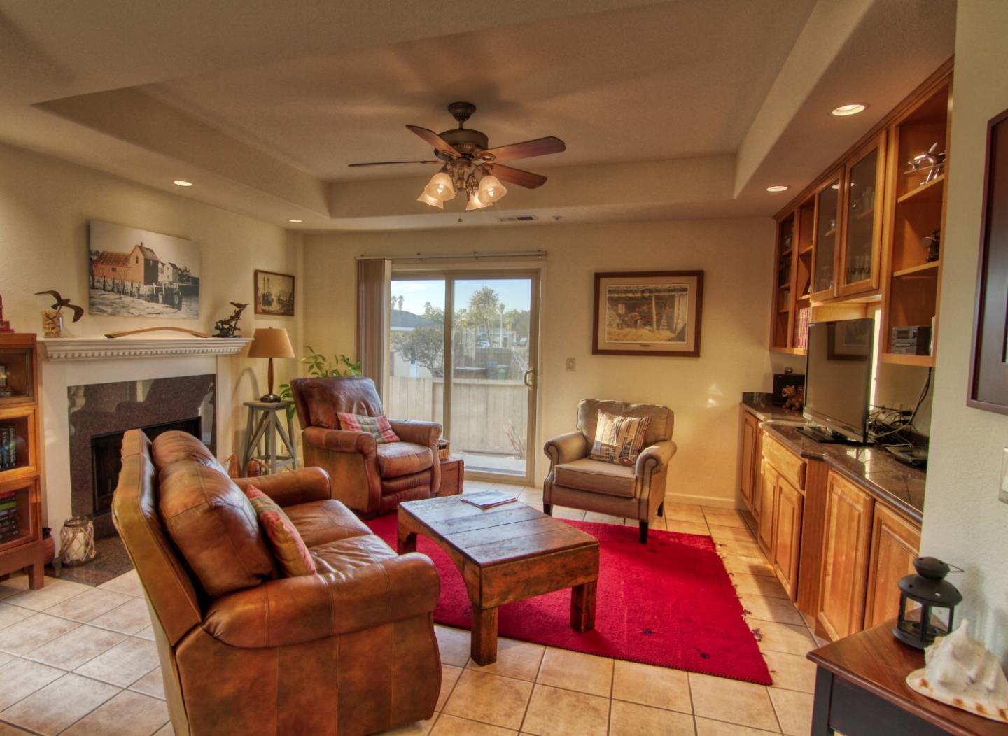 146 Katerina Lane Marina, CA 93933 - Photo 7 of 23 a living room with furniture a fireplace and a flat screen tv