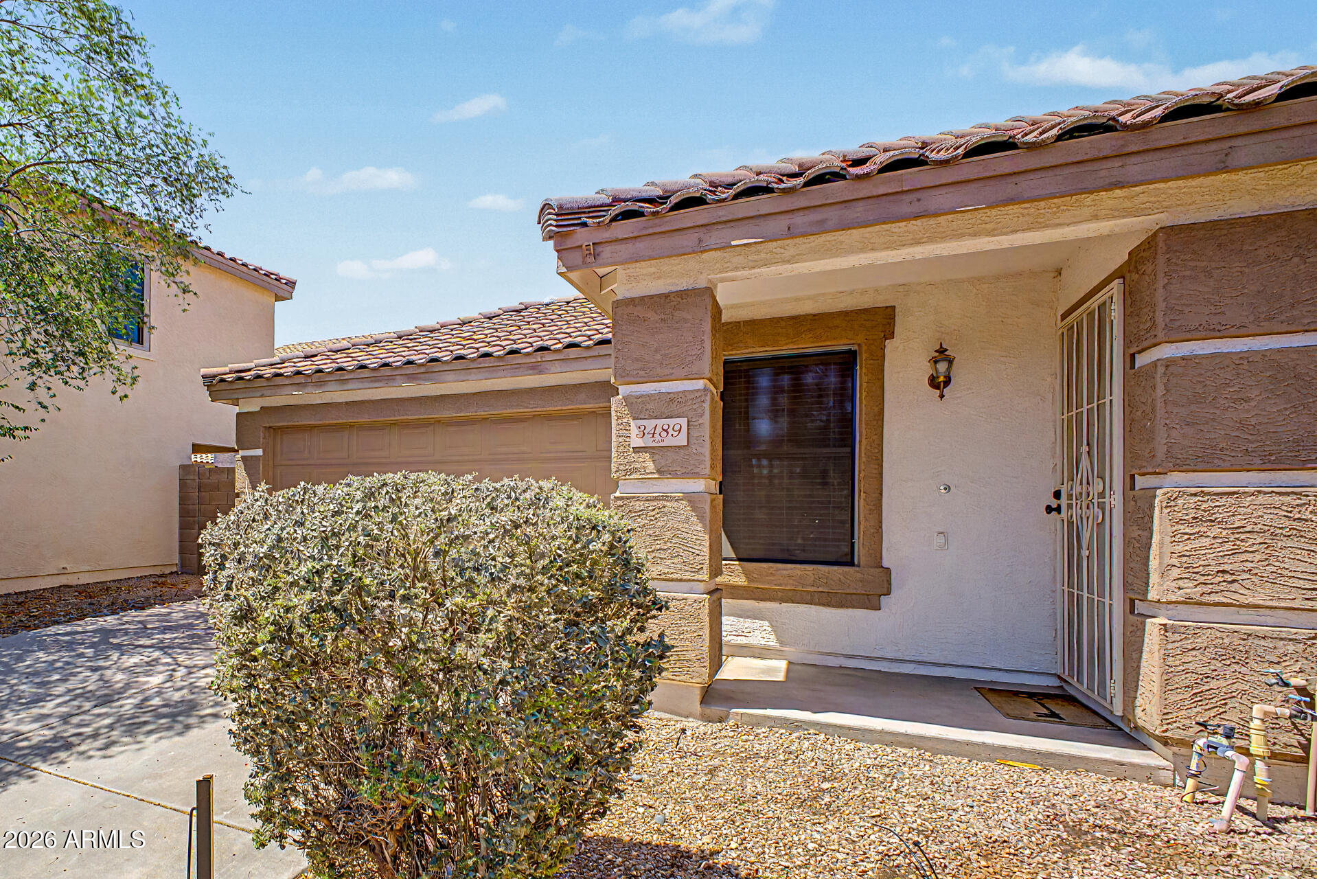 3489 South Bowman Road Apache Junction, AZ 85119 - Photo 12 of 24 front view of a house with a shower