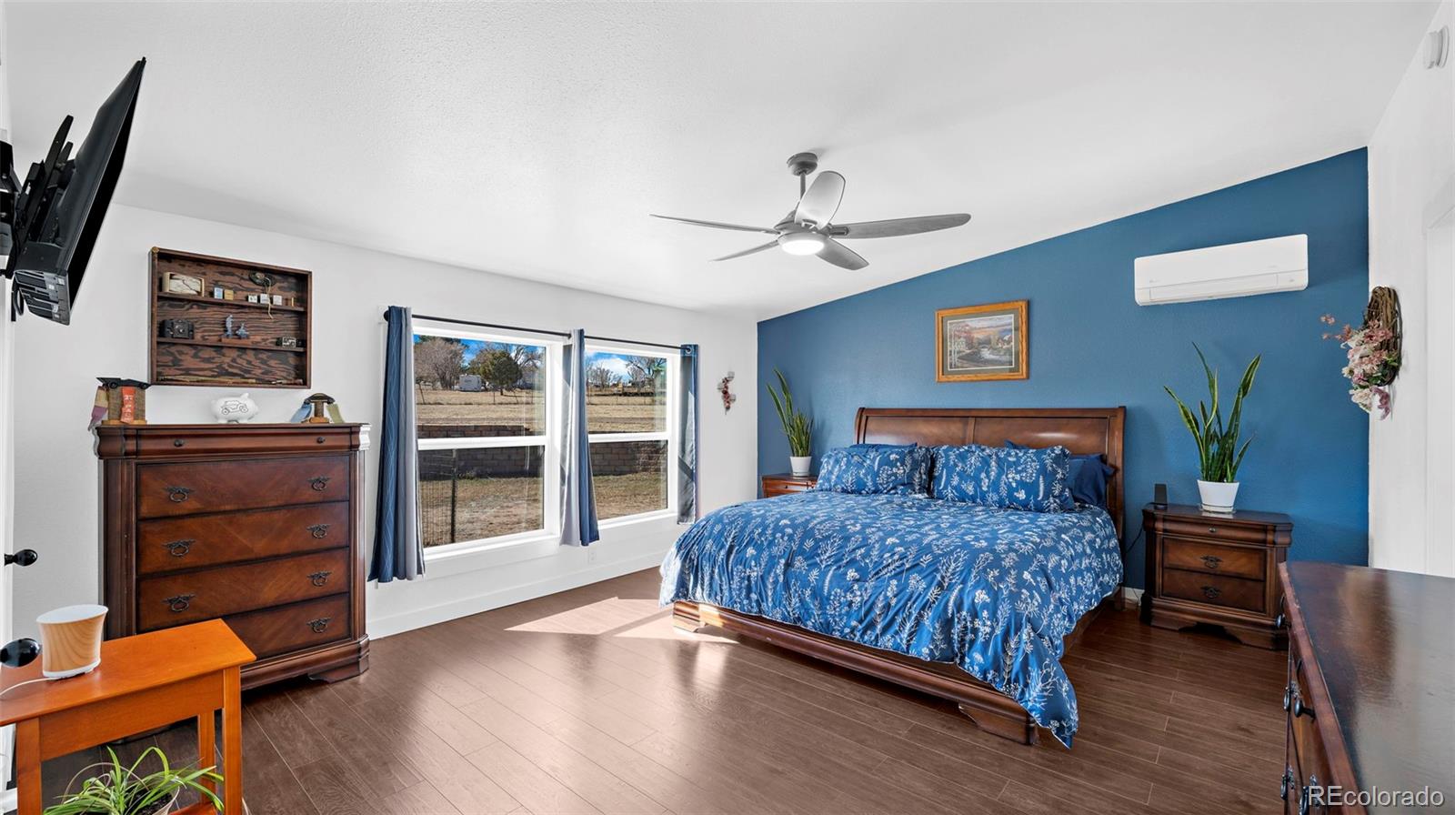 12340 Smith Road Peyton, CO 80831 - Photo 21 of 49 a bedroom with a bed and furniture